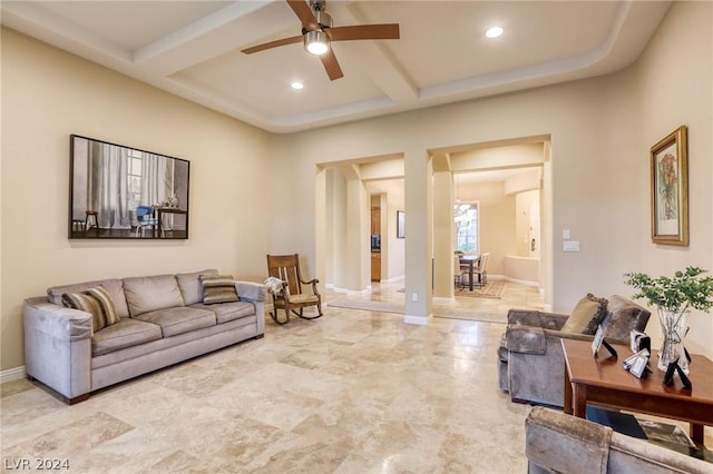 living room with beamed ceiling, ceiling fan, and coffered ceiling