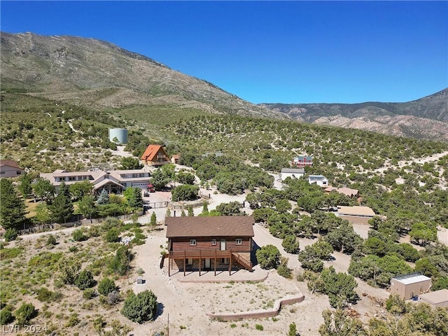 birds eye view of property with a mountain view