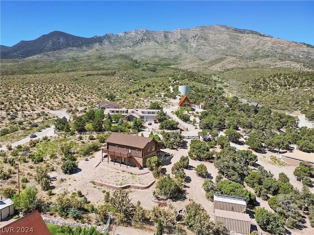 birds eye view of property with a mountain view