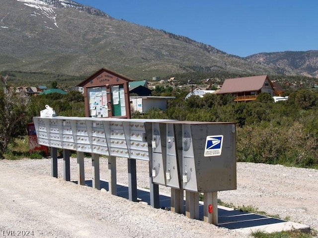 view of property's community with a mountain view and mail boxes