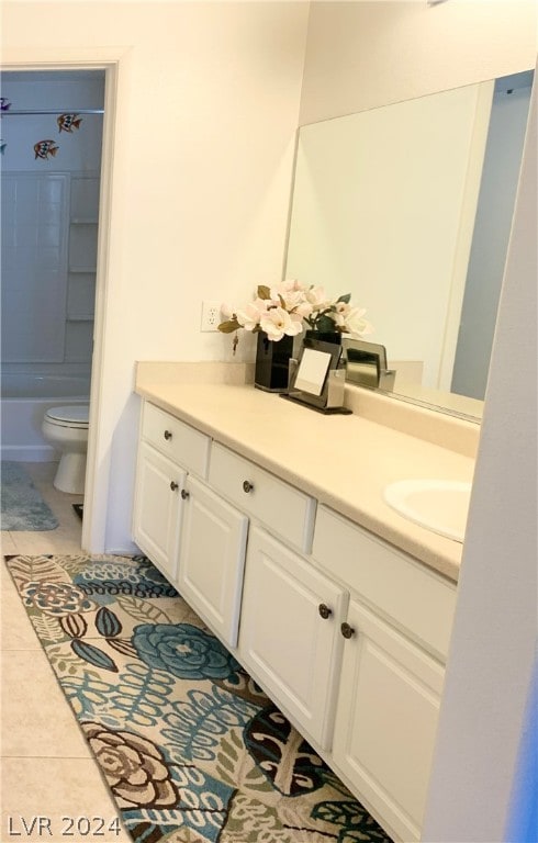 full bathroom featuring tile patterned floors, toilet, vanity, and tub / shower combination