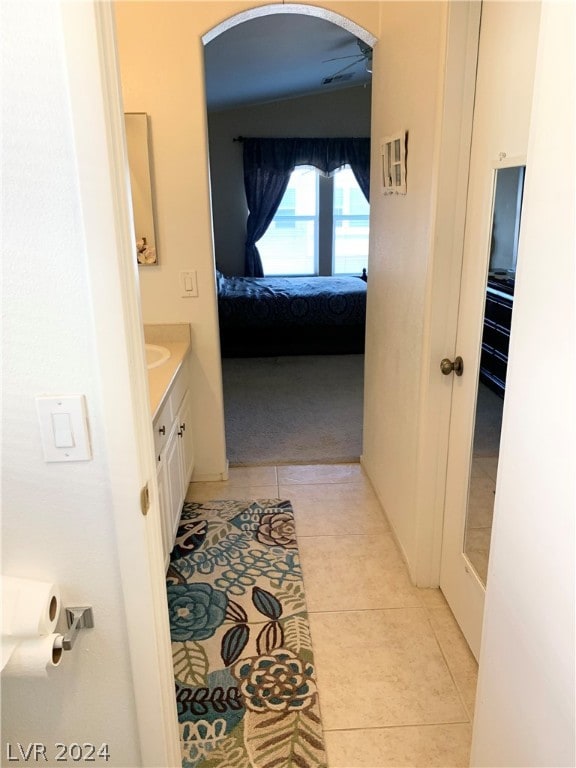 bathroom with tile patterned floors and vanity