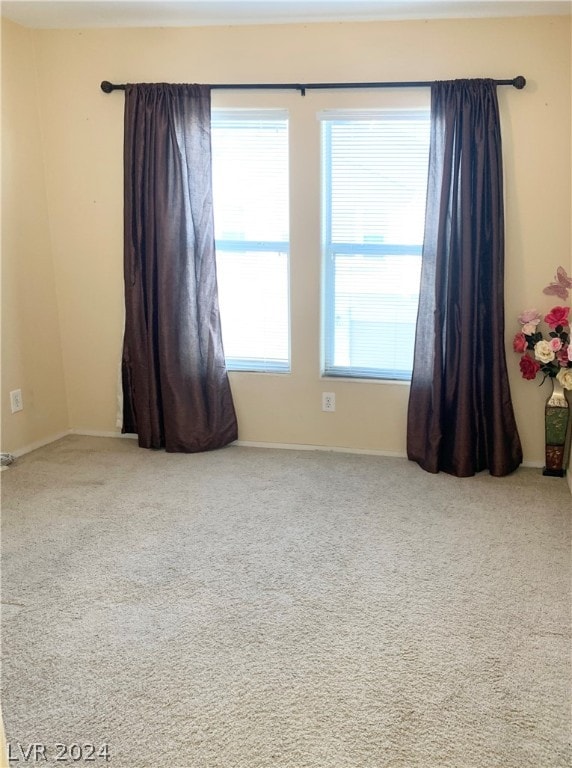 empty room featuring carpet floors