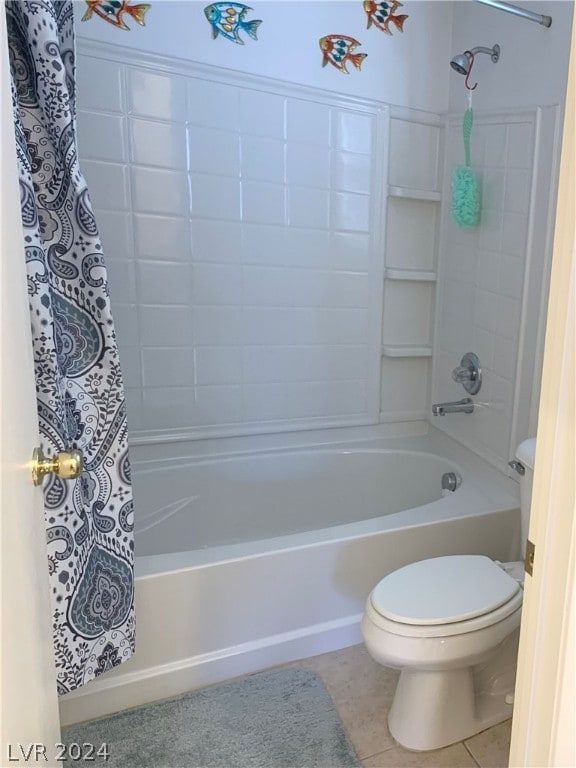 bathroom featuring shower / bath combo with shower curtain, tile patterned floors, and toilet