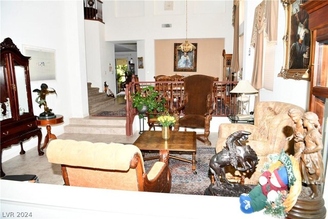 living room featuring tile patterned floors and a high ceiling