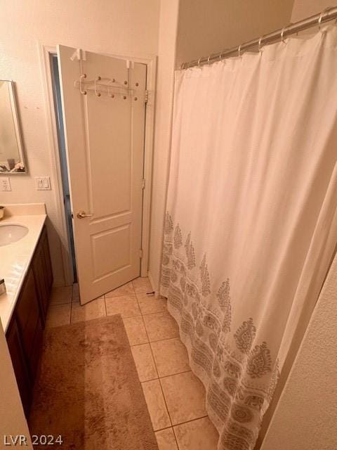 bathroom featuring tile patterned floors and vanity