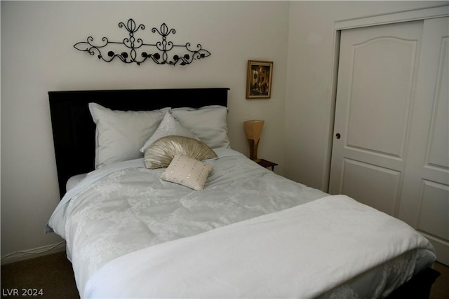 carpeted bedroom featuring a closet