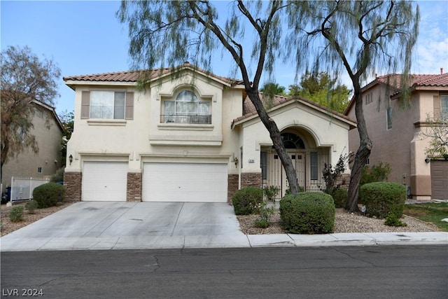 view of front of property with a garage