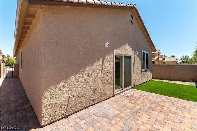 rear view of property featuring a patio