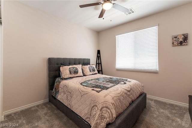 bedroom with dark carpet and ceiling fan