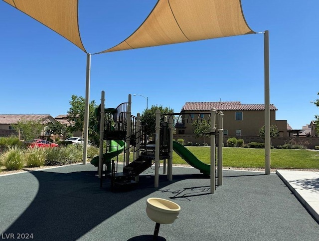 view of playground with a lawn