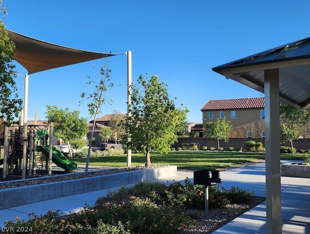 exterior space featuring a playground and a lawn