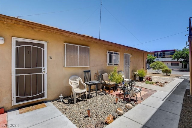 doorway to property featuring a patio