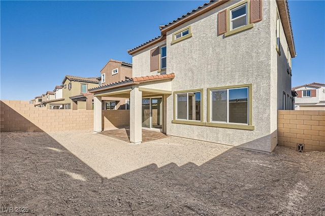 back of house featuring a patio