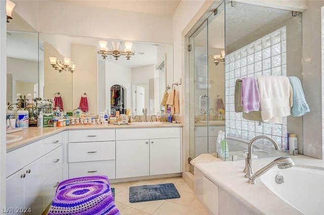 bathroom featuring tile patterned floors, plenty of natural light, vanity, and plus walk in shower