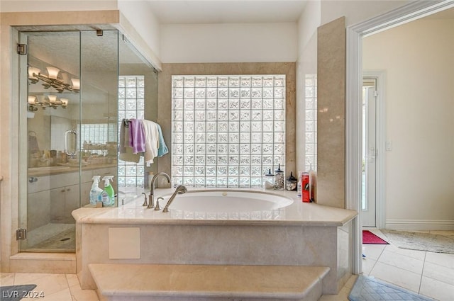 bathroom featuring tile patterned flooring and plus walk in shower