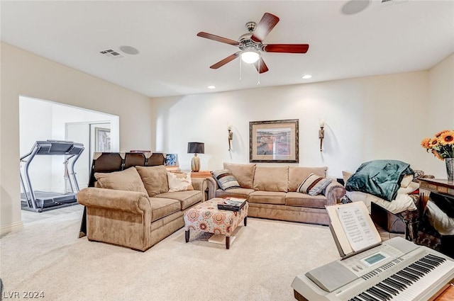 carpeted living room featuring ceiling fan