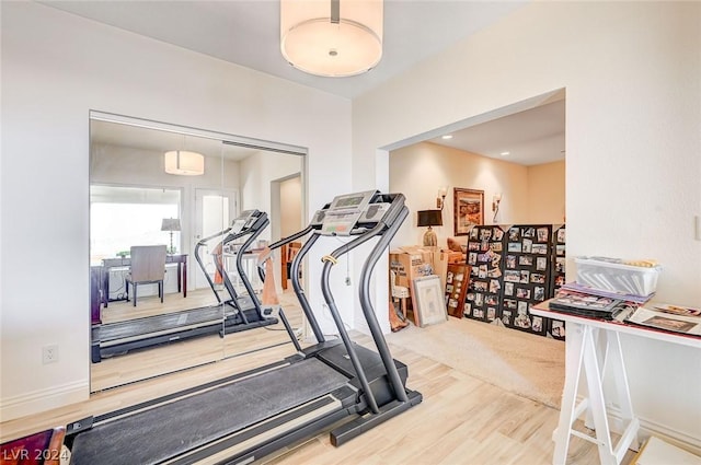 workout area featuring hardwood / wood-style floors