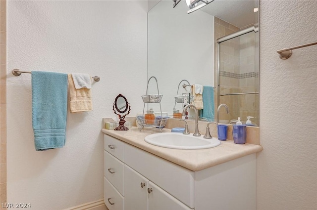 bathroom with vanity and walk in shower