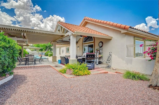 back of house featuring a patio area and a pergola