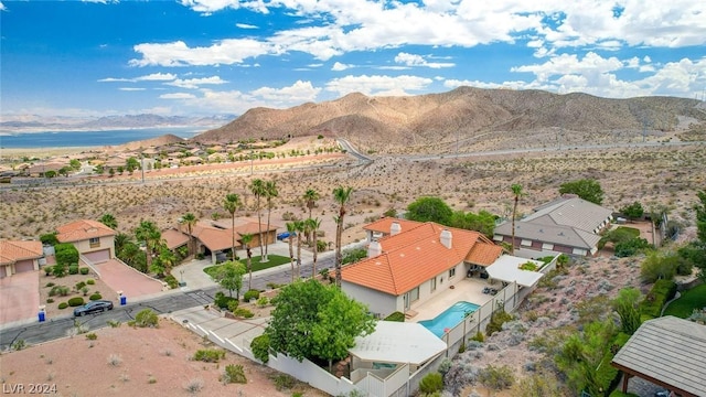 birds eye view of property featuring a mountain view