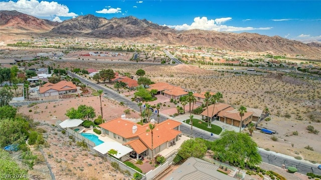 birds eye view of property with a mountain view