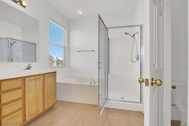 full bathroom with toilet, tile patterned flooring, shower with separate bathtub, and vanity