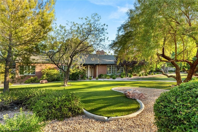 surrounding community featuring a lawn