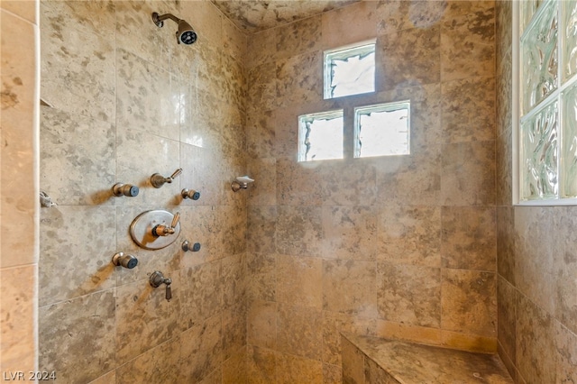 bathroom featuring tiled shower