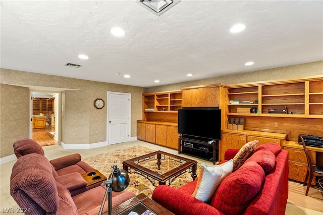 living room featuring a textured ceiling