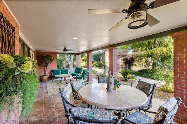 view of patio featuring ceiling fan