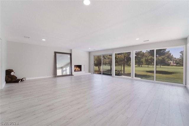 unfurnished living room featuring light wood-type flooring