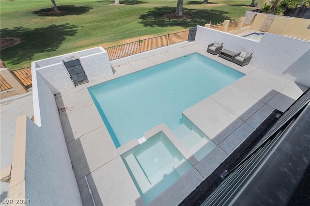 view of swimming pool with a lawn and a patio area