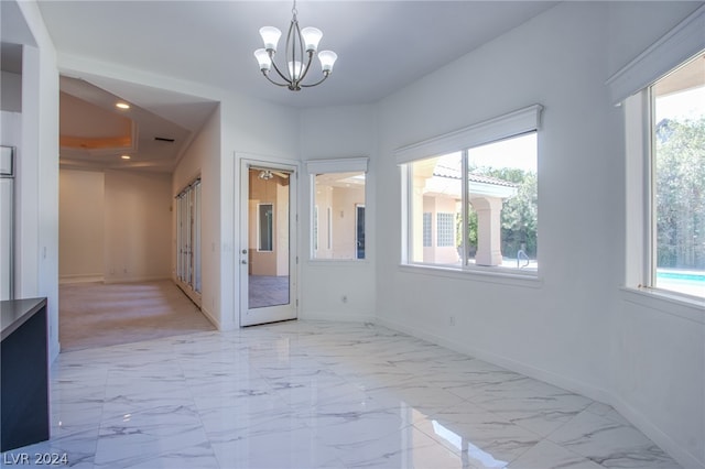 interior space featuring an inviting chandelier