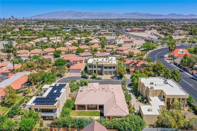 birds eye view of property with a mountain view