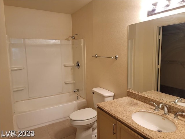 full bathroom featuring toilet, tile patterned floors, washtub / shower combination, and vanity