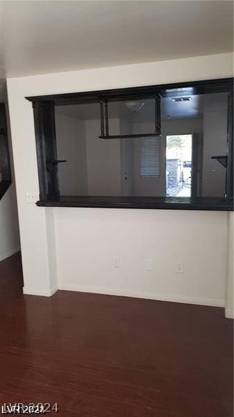 kitchen with dark hardwood / wood-style flooring