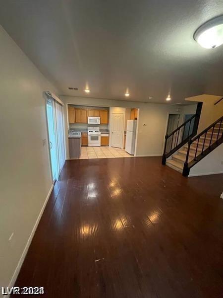 unfurnished living room with light wood-type flooring