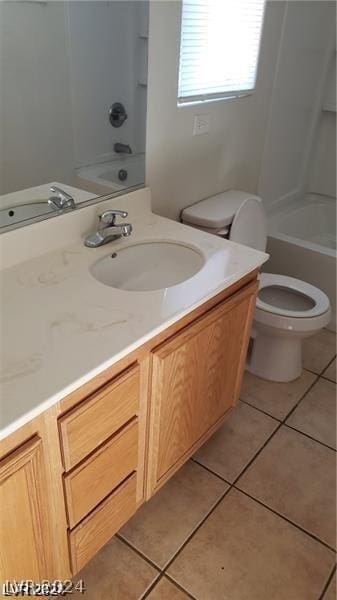 full bathroom featuring shower / bathtub combination, toilet, vanity, and tile patterned flooring