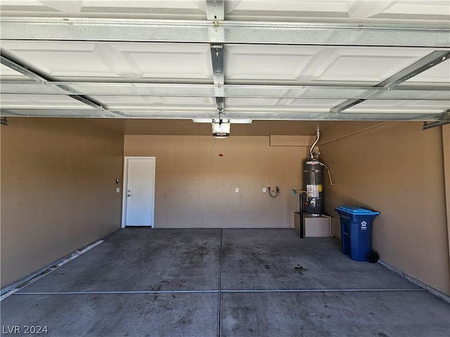 garage with water heater and a garage door opener