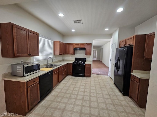 kitchen featuring sink and black appliances