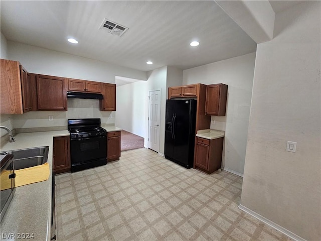 kitchen with black appliances and sink