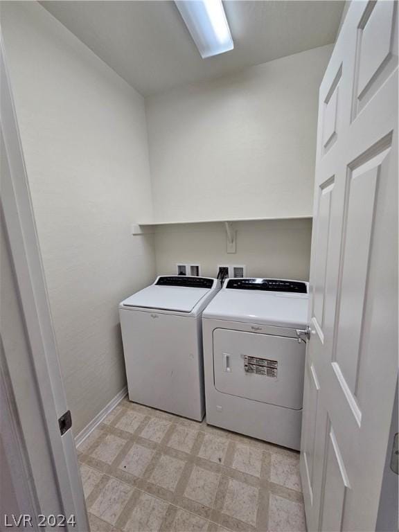 clothes washing area featuring separate washer and dryer