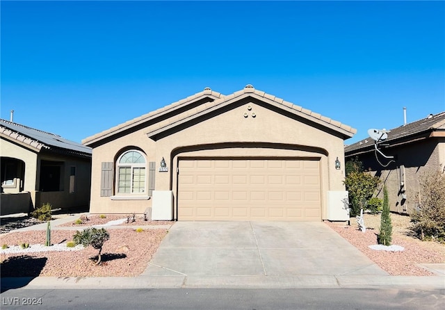 ranch-style home featuring a garage