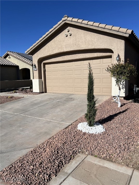 view of side of property with a garage