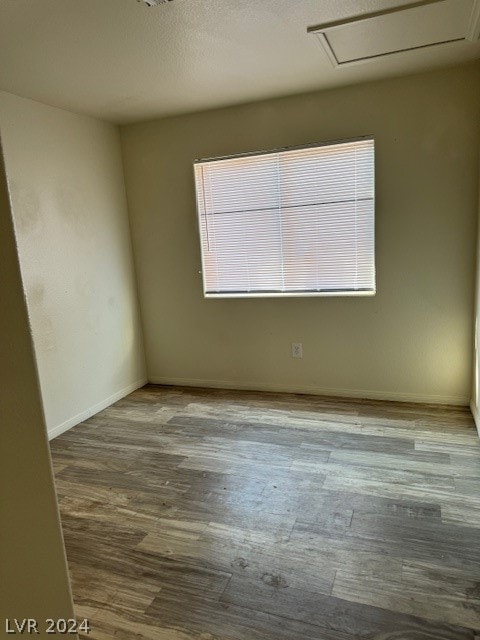 unfurnished room featuring hardwood / wood-style flooring