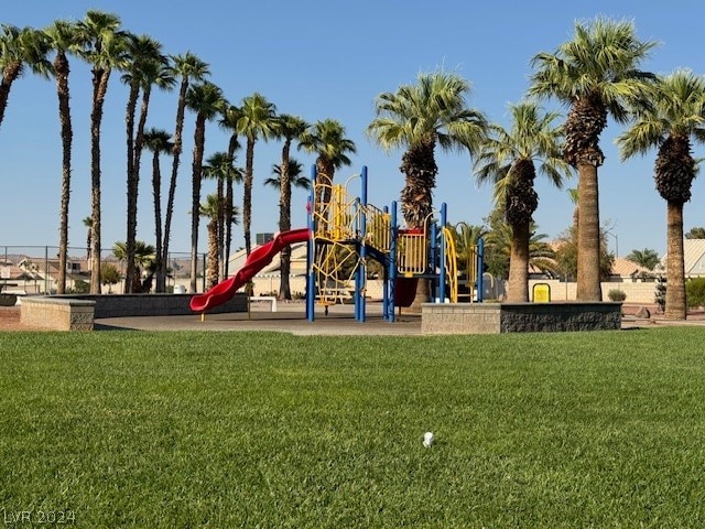 view of jungle gym featuring a lawn