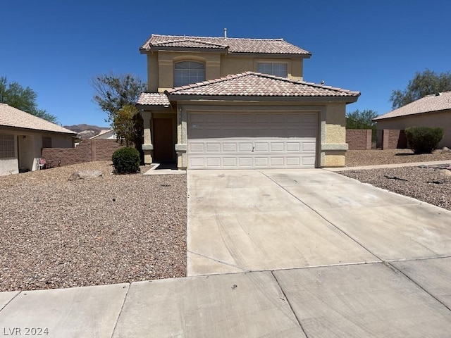 view of front of property with a garage