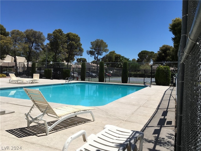 view of swimming pool with a patio area