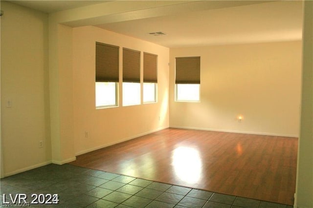 spare room with tile patterned floors